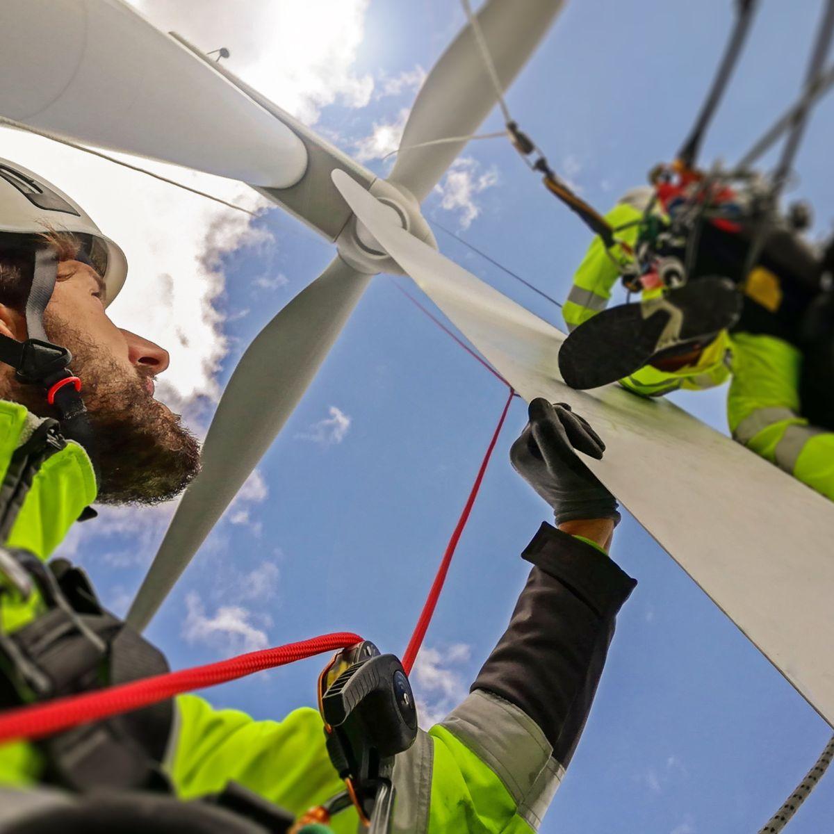 View from under on rope access of two technicians.