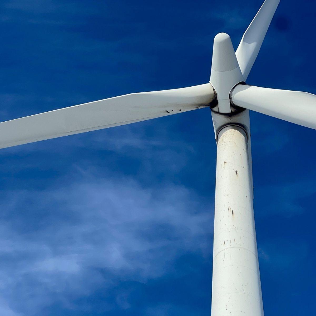Old wind turbine with a blue sky